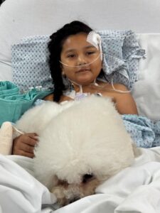 Child receiving oxygen therapy in a pediatric intensive care unit (PICU) for a severe respiratory infection.